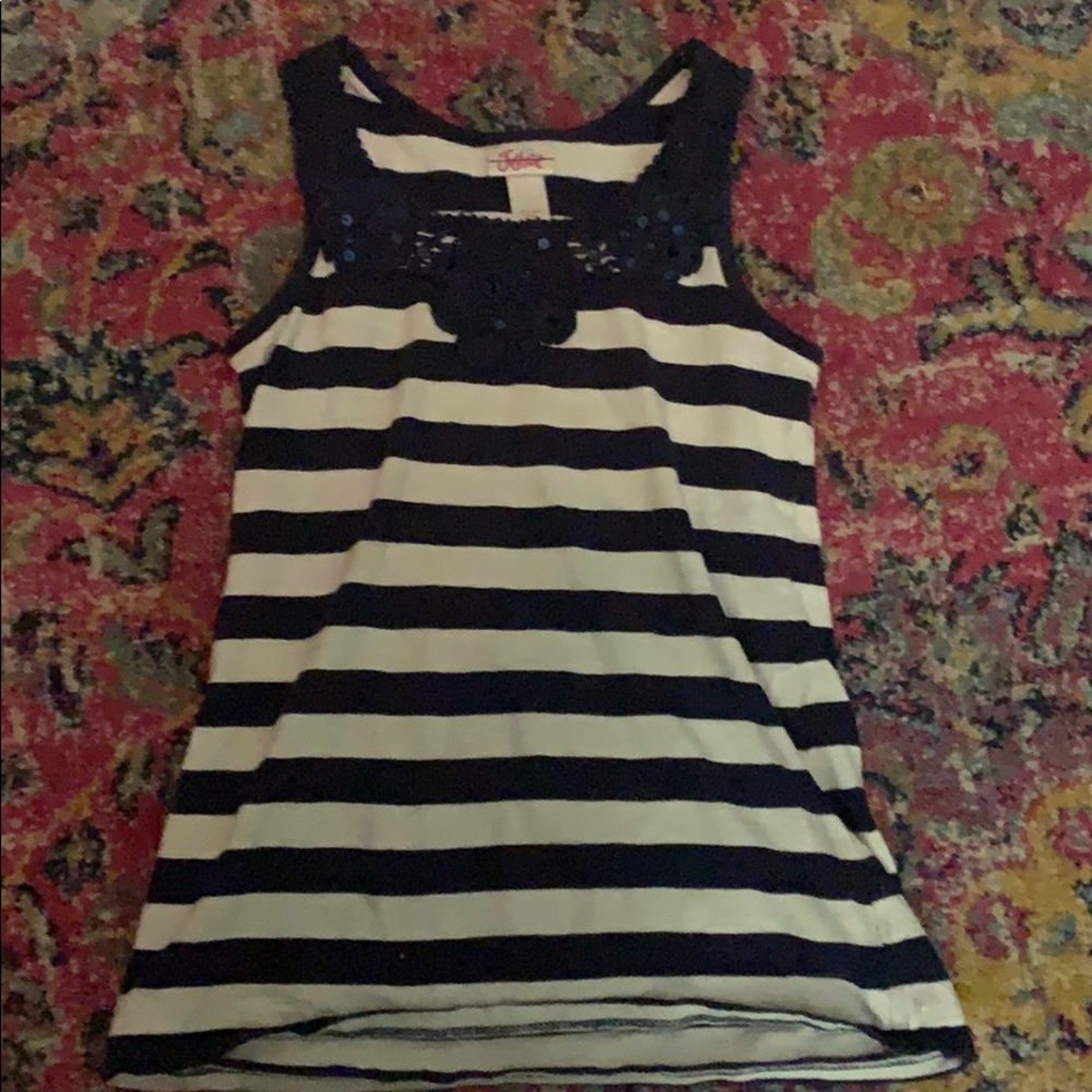 It is a navy blue and white justice tank top
